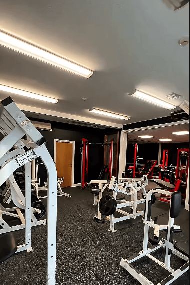 The Empire Gym floor — racks, plates and mirrors